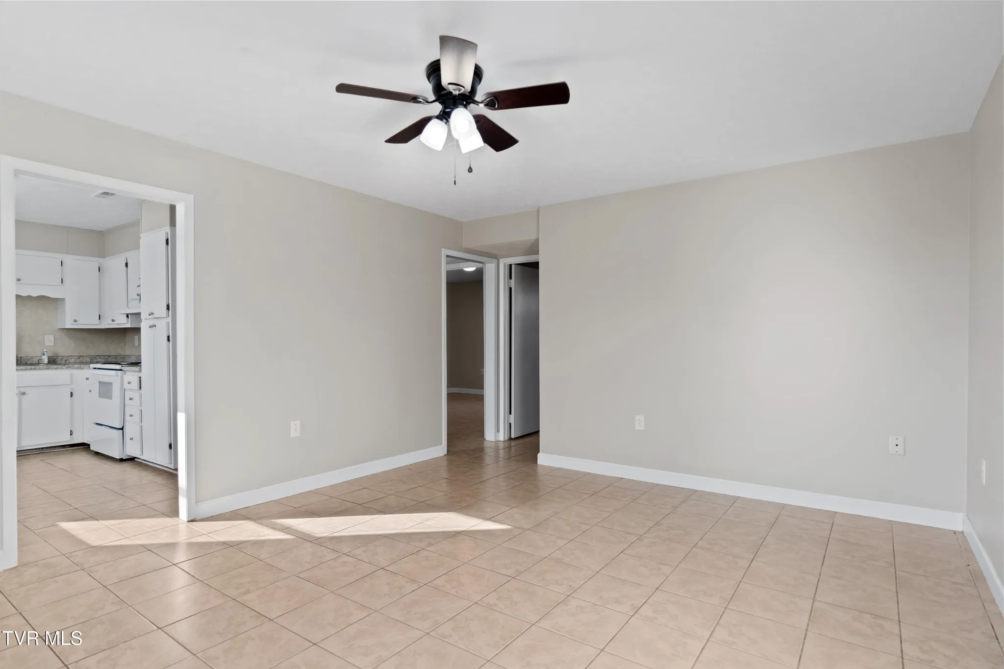 Image of living room, kitchen, and entrances to bedrooms at 1001 Kiser Blvd Greeneville TN